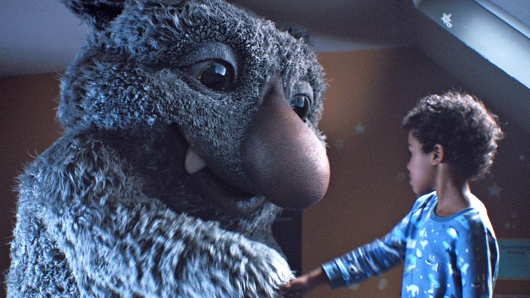 Moz the monster and seven-year-old Joe hope to lure in the shoppers for John Lewis this Xmas