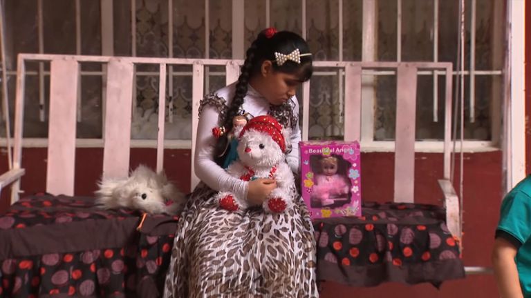 Maryam Samir with her toys at home in Mosul. She was hit in the head by an IS sniper&#39;s bullet