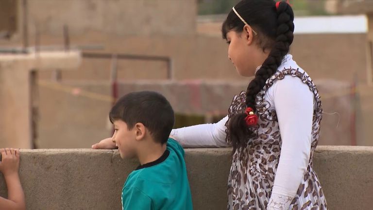 Maryam Samir, 12, was hit in the head by an IS sniper&#39;s bullet. Here she looks over Mosul with her brother