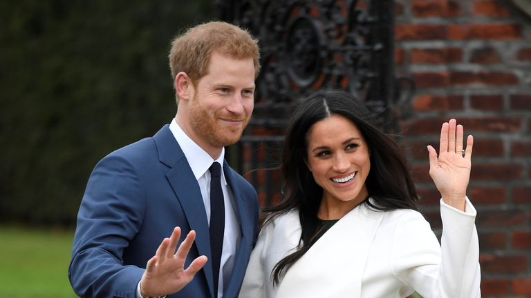 Prince Harry poses with Meghan Markle