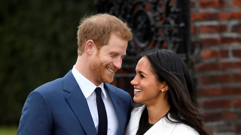 Prince Harry poses with Meghan Markle