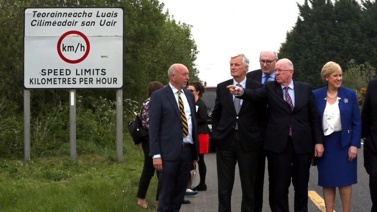 European Commission (EC) member in charge of Brexit negotiations with Britain, Michel Barnier (2nd L) is shown a border road in Co Monaghan between Republic of Ireland and Northern Ireland on May 12, 2017