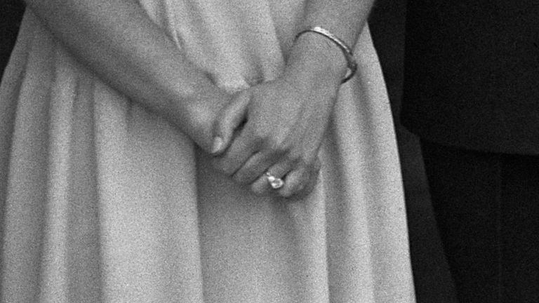 The Queen, then Princess Elizabeth, shows off her engagement ring at Buckingham Palace in July 1947