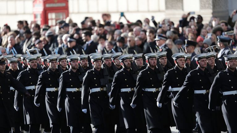 Members of the armed forces parade before the two-minute silence in Whitehall