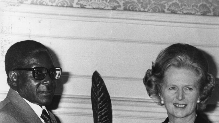 Mr Mugabe shakes hands with then prime minister Margaret Thatcher in 1980