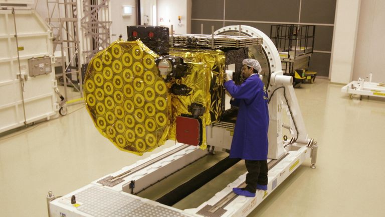 A European Space Agency technician works on the Giove B satellite, which forms part of the Galileo network