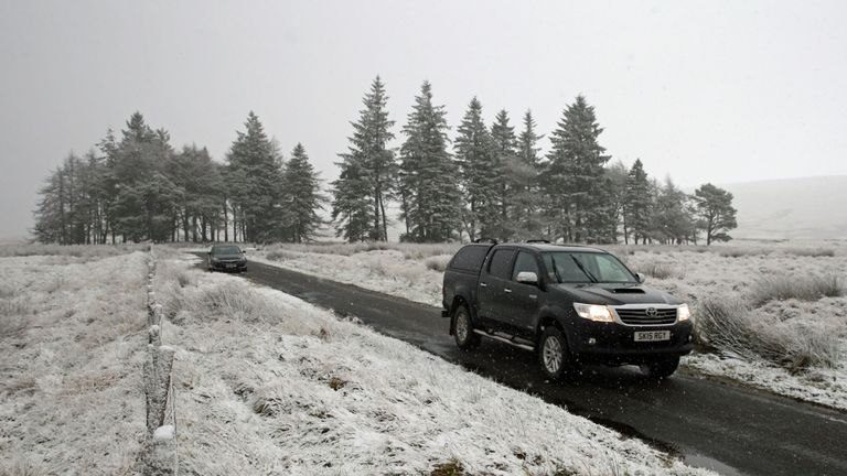 A car driving through light snow in Sheriffmuir, near Dunblane, as wintry showers are forecast for many parts of Scotland