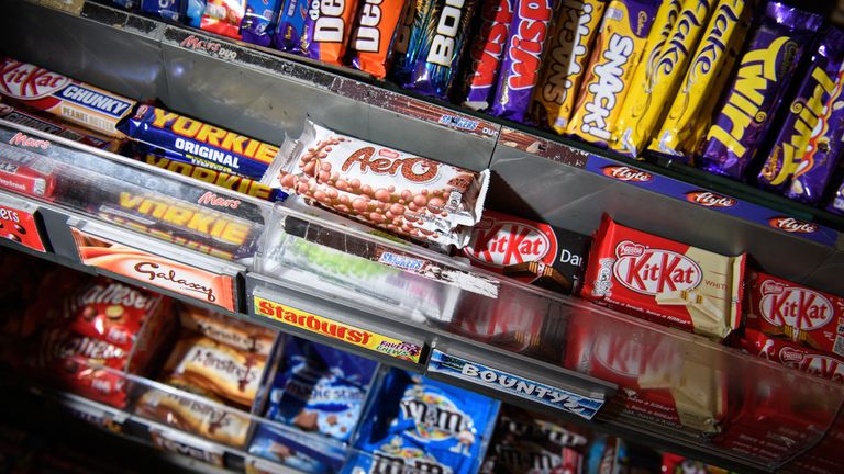 A selection of confectionery and chocolates are seen on a newsagent shelf on December 8, 2016 in London, England. The Committee on Advertising Practice has announced a ban on online advertisements for food and drinks with a high fat, salt or sugar content