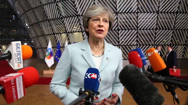 British Prime Minister Theresa May speaks to journalists as she arrives for an ?EU Eastern Partnership summit with six eastern partner countries at the European Council in Brussels on November 24, 2017