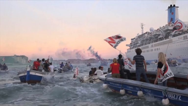 Protesters greet a cruise ship in Venice