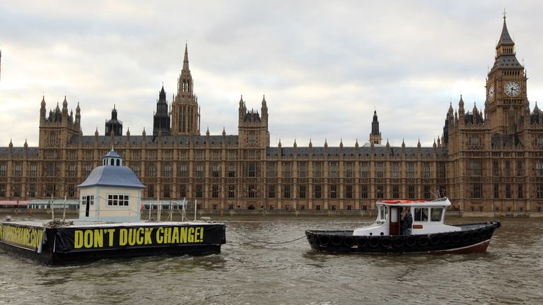 A giant duck house is towed past Westminster at the height of the expenses scandal in 2009