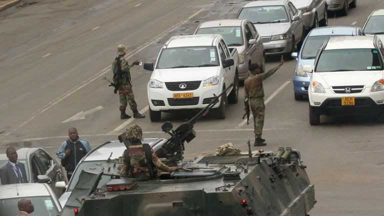 Military vehicles and soldiers patrol the streets in Harare, Zimbabwe
