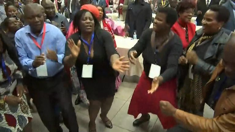 ZANU-PF party members celebrate the dismissal of leader Robert Mugabe