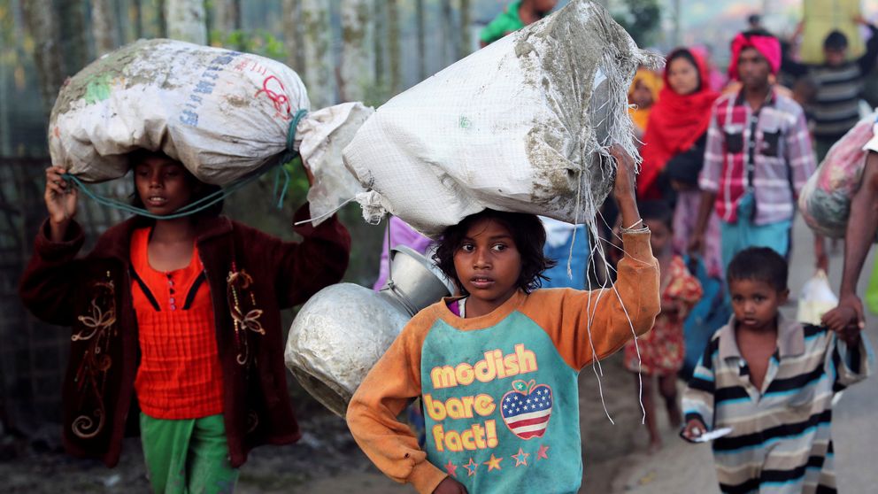 A little girl makes her way towards a makeshift camp in Cox's Bazar, Bangladesh