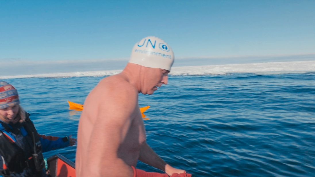 UN Patron of the Oceans Lewis Pugh preparing to swim near the Arctic ice sheet