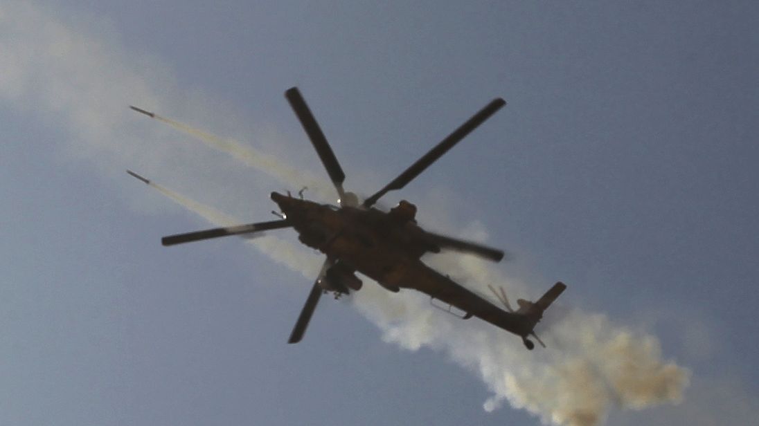 An Iraqi army helicopter fires at a target near Al-Ayadieh village, the last remaining active front line near Tal Afar, during an operation to retake the city from the Islamic State (IS) group on August 29, 2017. / AFP PHOTO / AHMAD AL-RUBAYE (Photo credit should read AHMAD AL-RUBAYE/AFP/Getty Images)
