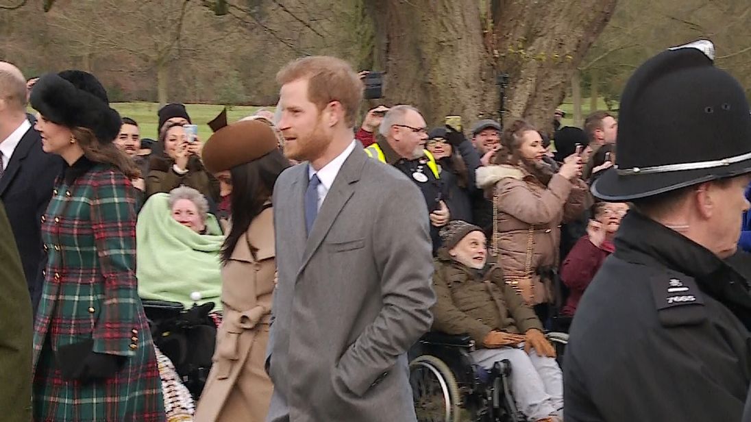 The newly engaged couple arrive at church arm-in-arm