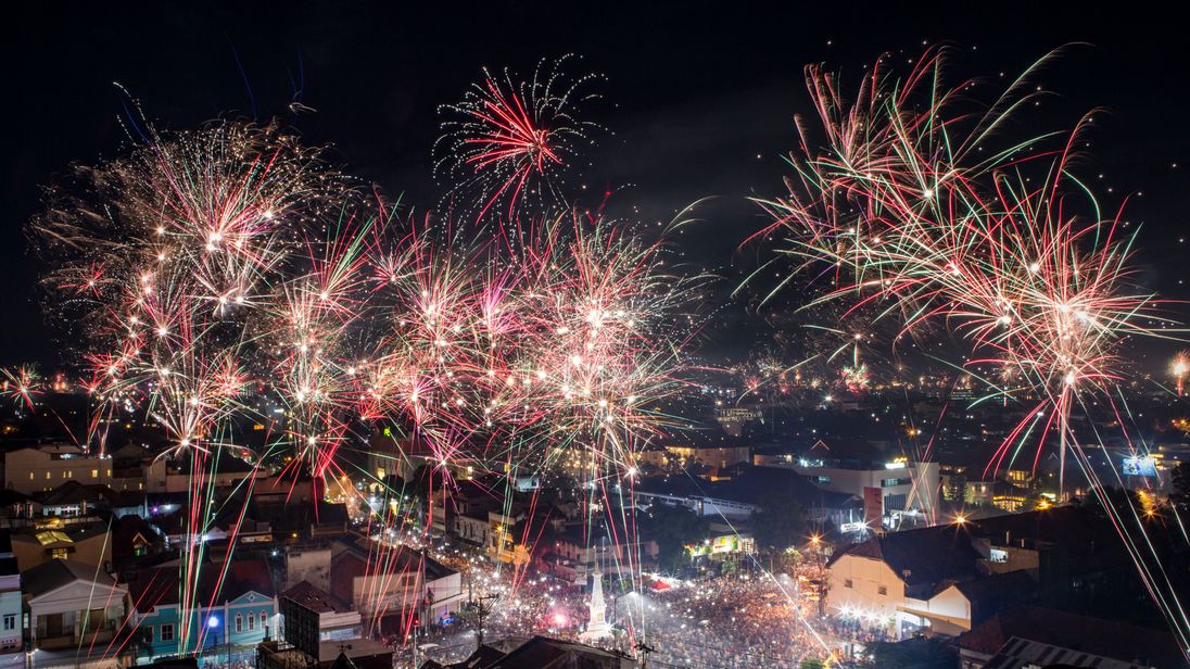 YOGYAKARTA, INDONESIA - JANUARY 01: Fireworks illuminate the city&#39;s skyline during New Year&#39;s Eve celebrations of 2018