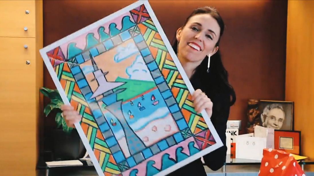 New Zealand Prime Minister Jacinda Ardern with her secret santa present 

 