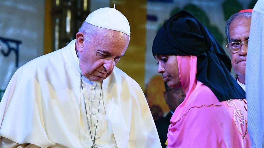 Pope Francis meets with a Rohingya refugee during an interreligious meeting at the Archbishop&#39;s house in Dhaka.