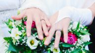 Newlywed women show their rings