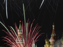 Fireworks explode over the Kremlin and St Basil Cathedral during New Year celebrations in central Moscow early on January 1, 2018. / AFP PHOTO / Kirill KUDRYAVTSEV (Photo credit should read KIRILL KUDRYAVTSEV/AFP/Getty Images)