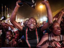 People react after counting down to New Year's day on January 1, 2018, during the New Year's music event at Kenyatta International Convention Centre (KICC) in Nairobi, Kenya