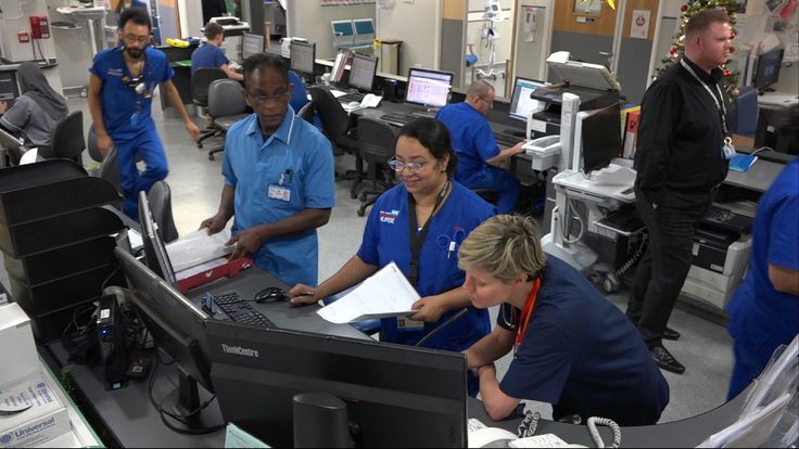 Hospital staff at desks in hospital