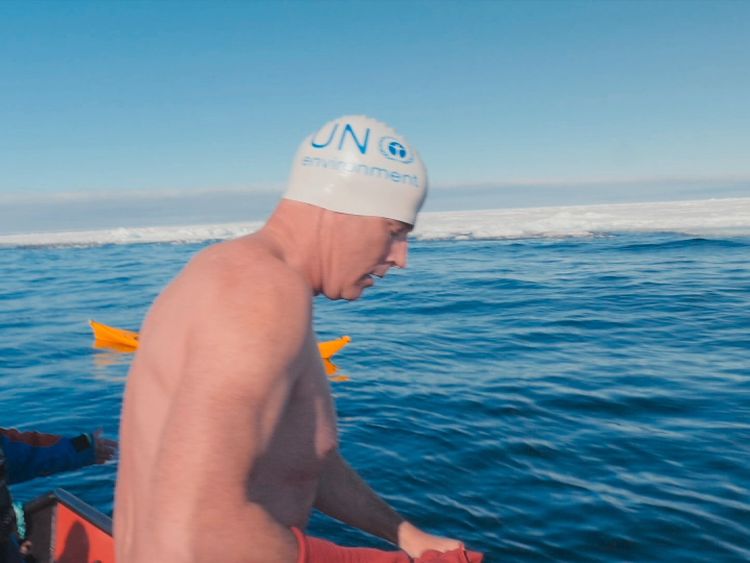 UN Patron of the Oceans Lewis Pugh preparing to swim near the Arctic ice sheet