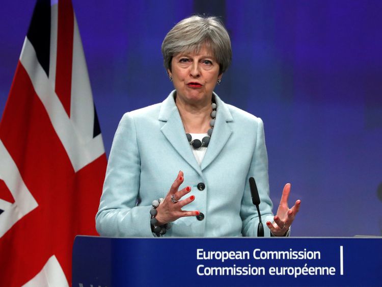 Theresa May and European Commission President Jean-Claude Juncker hold a news conference at the EC headquarters in Brussels