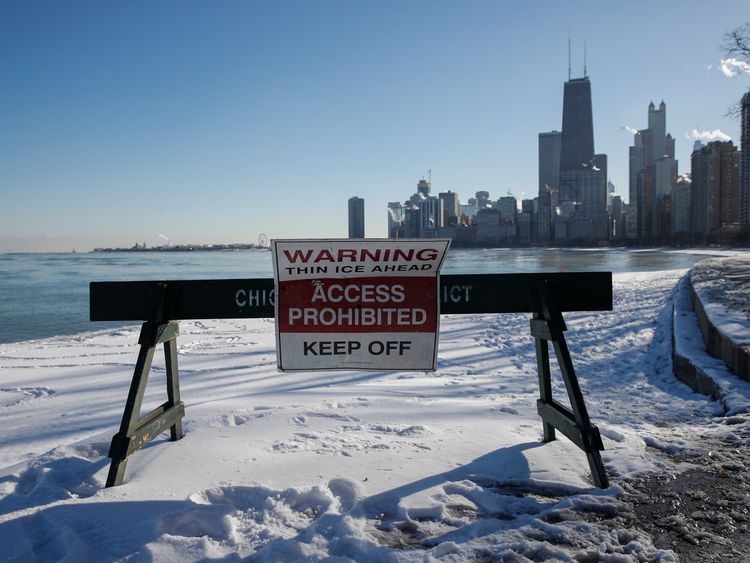 Pedestrians are warned away from the lakefront in Chicago, Illinois