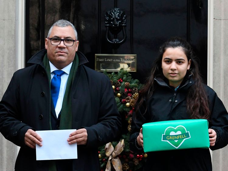 Grenfell Tower survivor Nicholas Burton presents a petition to Theresa May calling for an independent panel to sit alongside the judge in the inquiry into the disaster