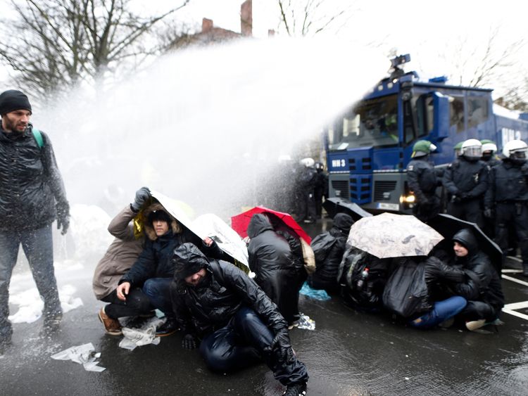 Police use water cannon to disperse protesters