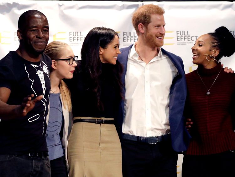 Harry and Meghan with the cast of a hip hop opera put on by the Full Effect programme