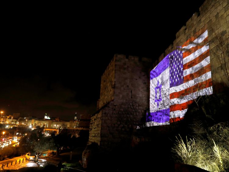 Israeli and American flags are projected on a part of the walls surrounding Jerusalem&#39;s Old City