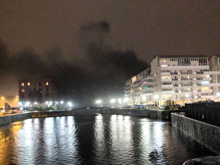 Black smoke billows across Liverpool&#39;s waterfront. Pic: Mike Quek/PA Wire