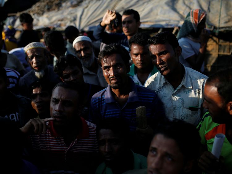 People wait for food at a camp in Bangladesh