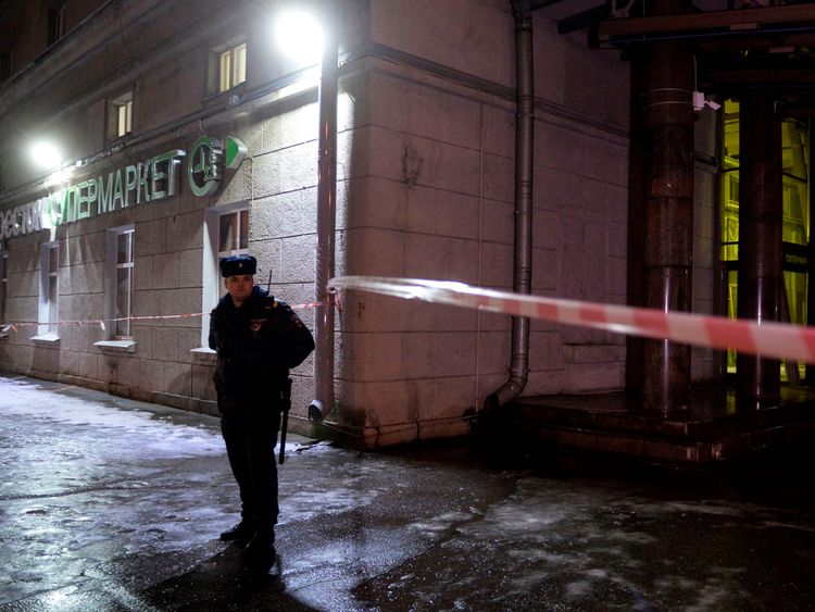 A police officer cordons off the site of a blast in a supermarket in Saint Petersburg on December 27, 2017. / AFP PHOTO / Olga MALTSEVA (Photo credit should read OLGA MALTSEVA/AFP/Getty Images)
