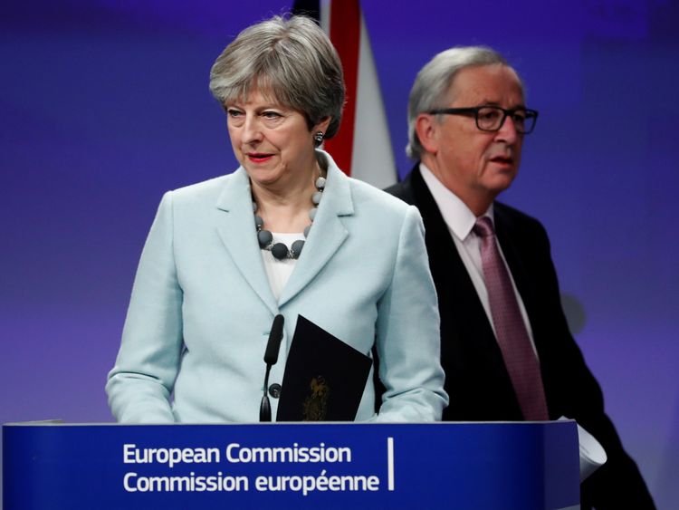 Theresa May and European Commission President Jean-Claude Juncker hold a news conference at the EC headquarters in Brussels