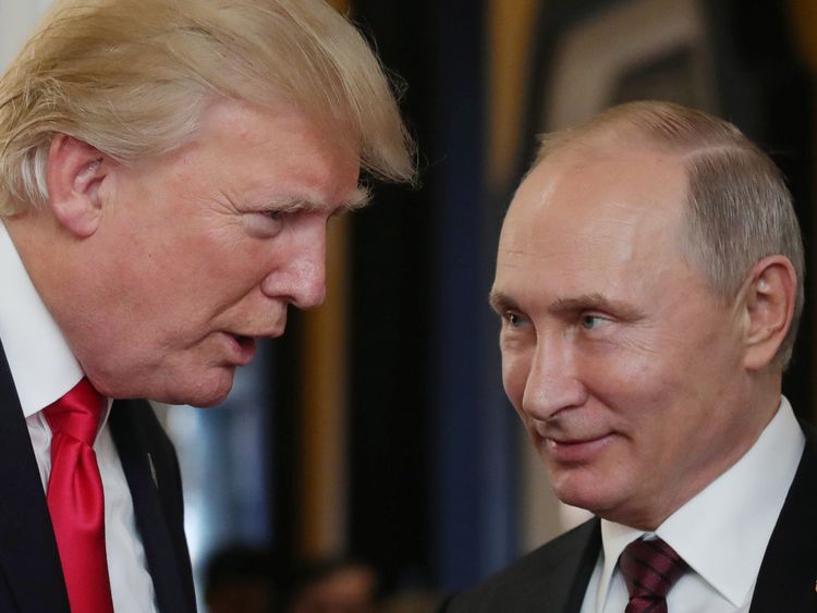 US President Donald Trump chats with Russia's President Vladimir Putin