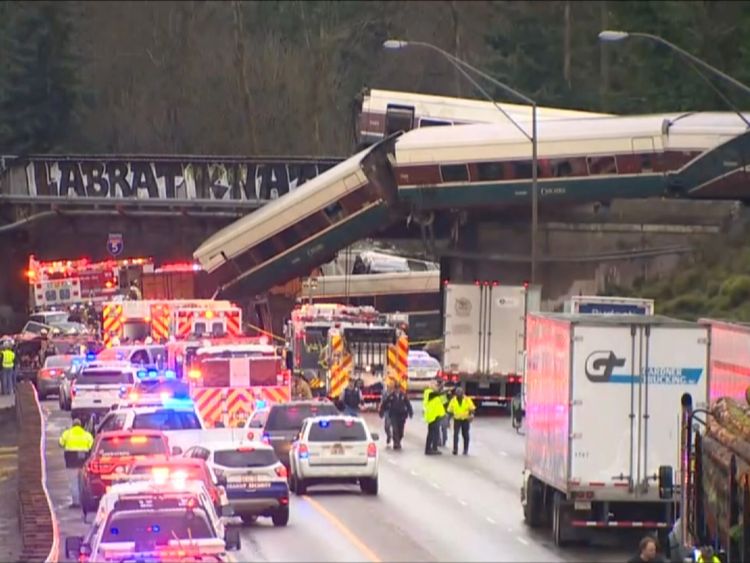 Amtrak carriages fell onto the highway below during the train's first journey on a new track.