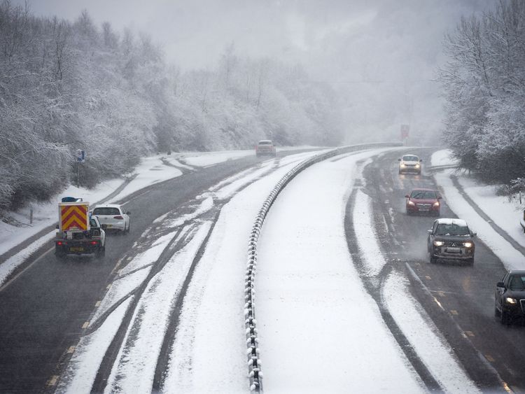 Traffic is forced to drive in one lane as snow covers most of the A470 dual carriageway near Merthyr Tydfil, Wales