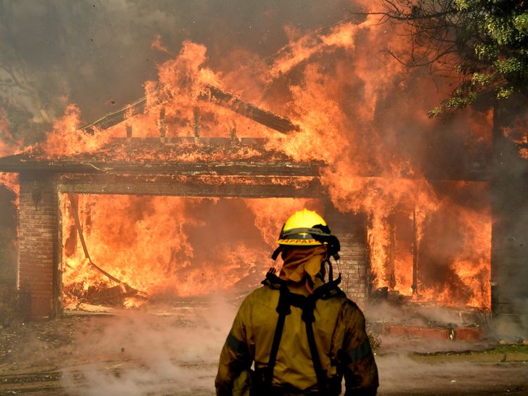 Firefighters battled to put out a house on fire in the San Fernando valley north of Los Angeles