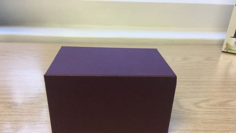 The ashes of the twins were contained in a maroon box