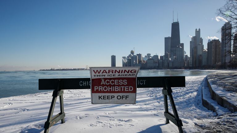 Pedestrians are warned away from the lakefront in Chicago, Illinois
