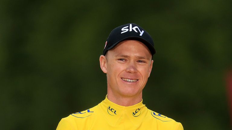 Team Sky&#39;s Chris Froome celebrates with his trophy after stage 21 of the Tour de France.