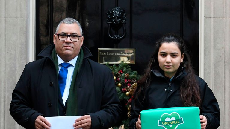 Grenfell Tower survivor Nicholas Burton presents a petition to Theresa May calling for an independent panel to sit alongside the judge in the inquiry into the disaster