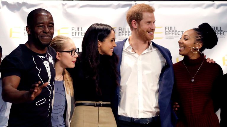 Harry and Meghan with the cast of a hip hop opera put on by the Full Effect programme