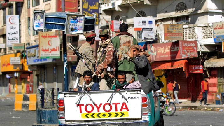 Huthi rebel fighters are seen atop an armoured vehicle in front of the residence of Yemen&#39;s former President Ali Abdullah Saleh in Sanaa