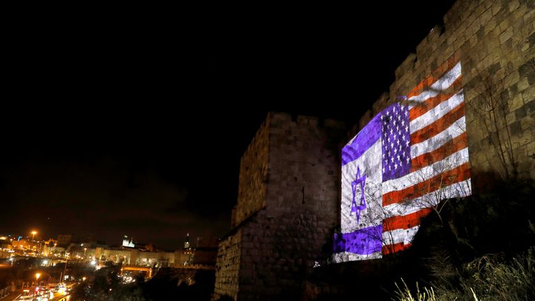 Israeli and American flags are projected on a part of the walls surrounding Jerusalem&#39;s Old City